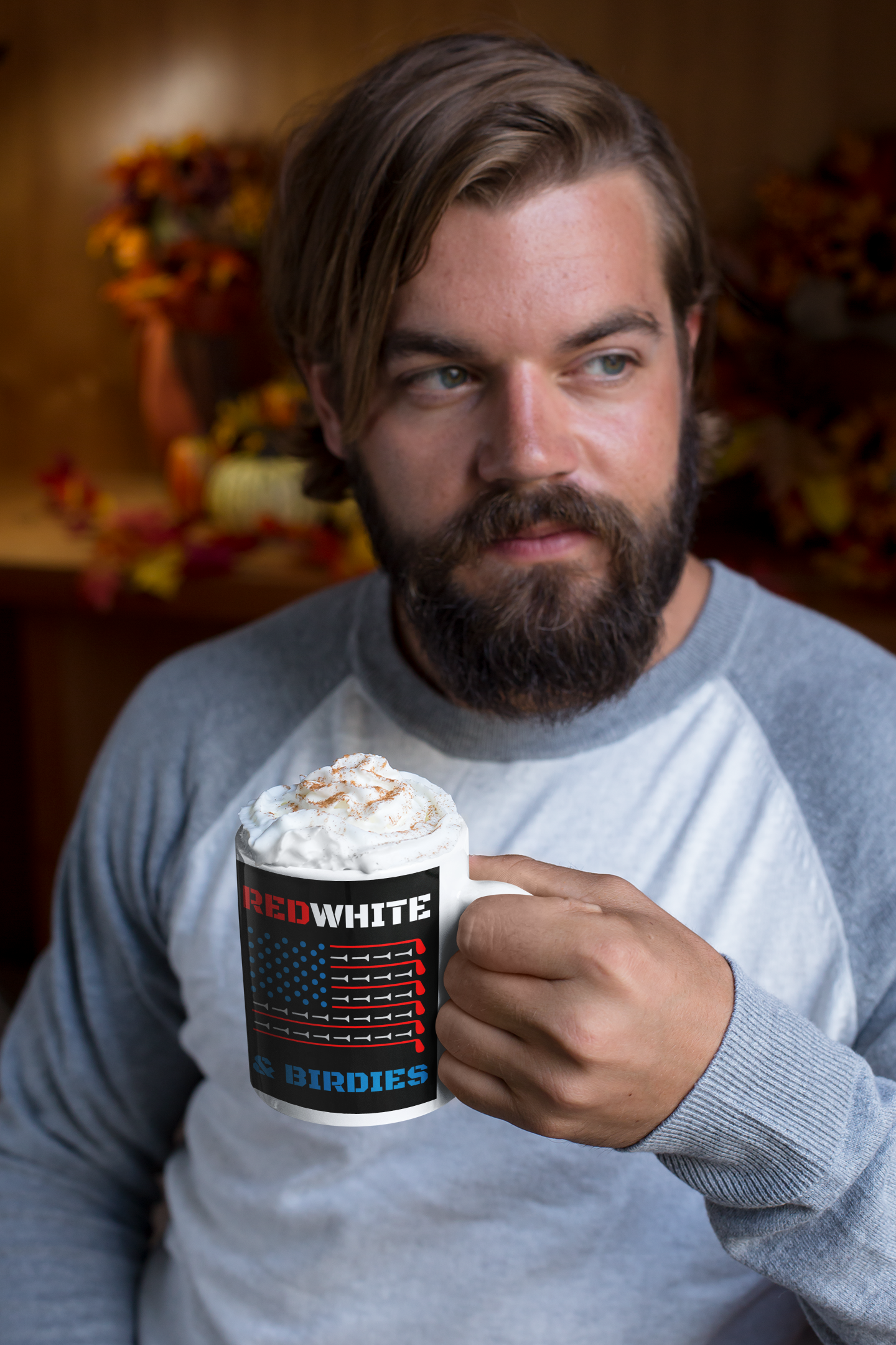 Coffee mug with red, white, and blue golf tee flag design