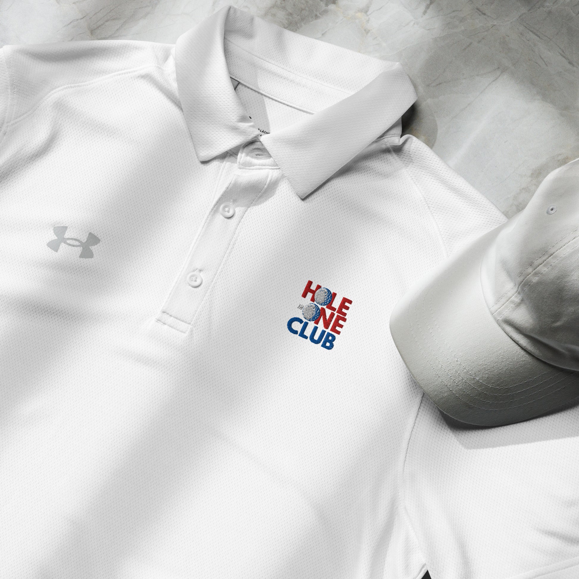 white under armour golf polo with hole in one club logo