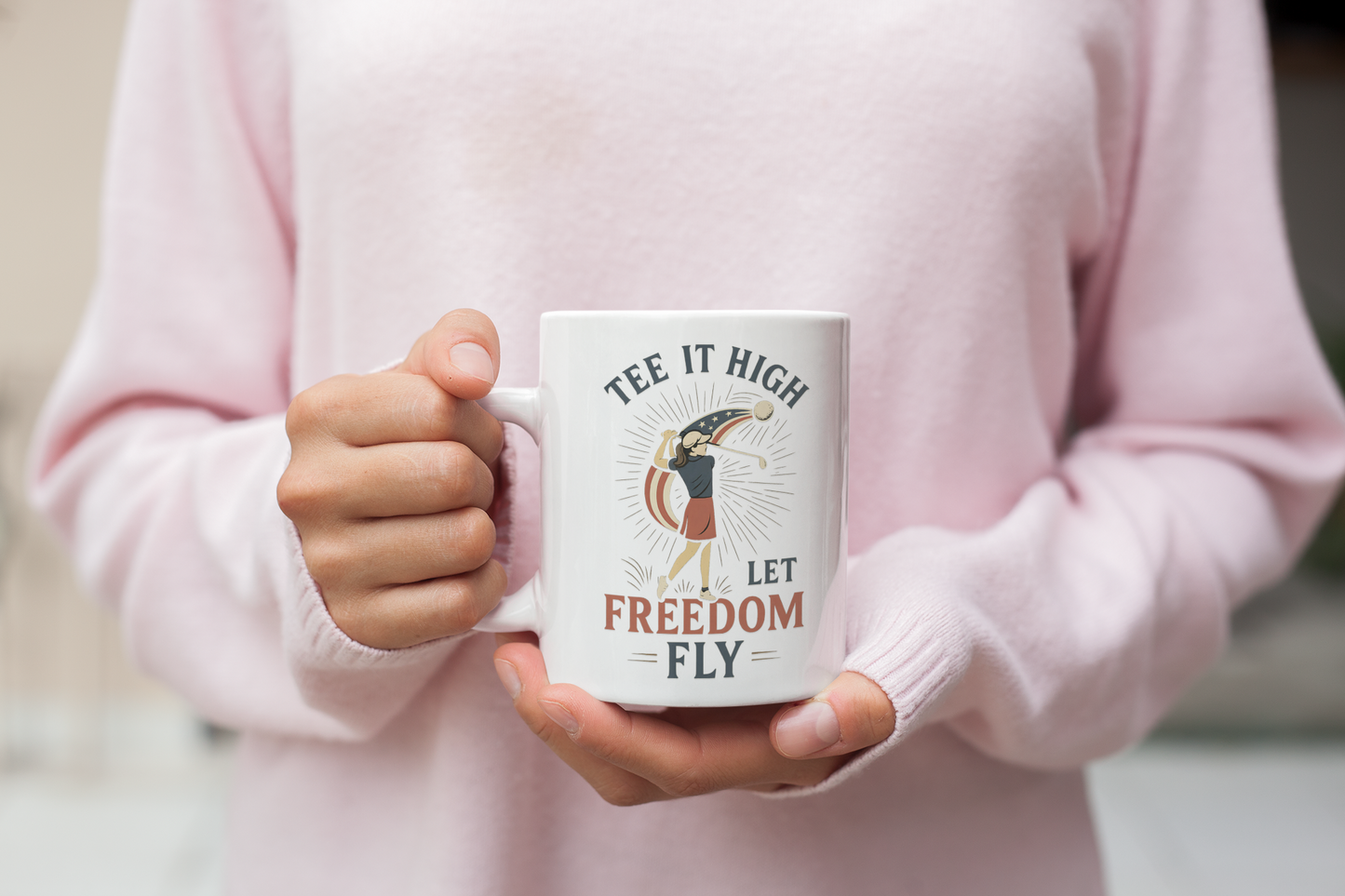 White ceramic mug with female golfer swing illustration and freedom slogan