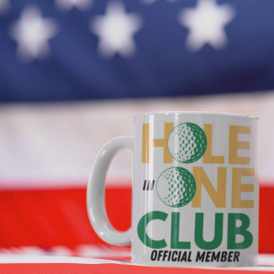 High-contrast coffee mug with green, gold, and black color scheme
