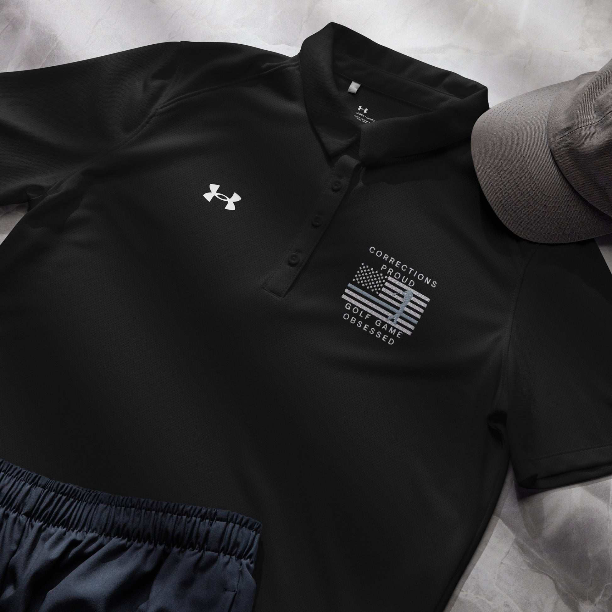 Black women's Under Armour golf polo with Corrections Proud Golf Game Obsessed design