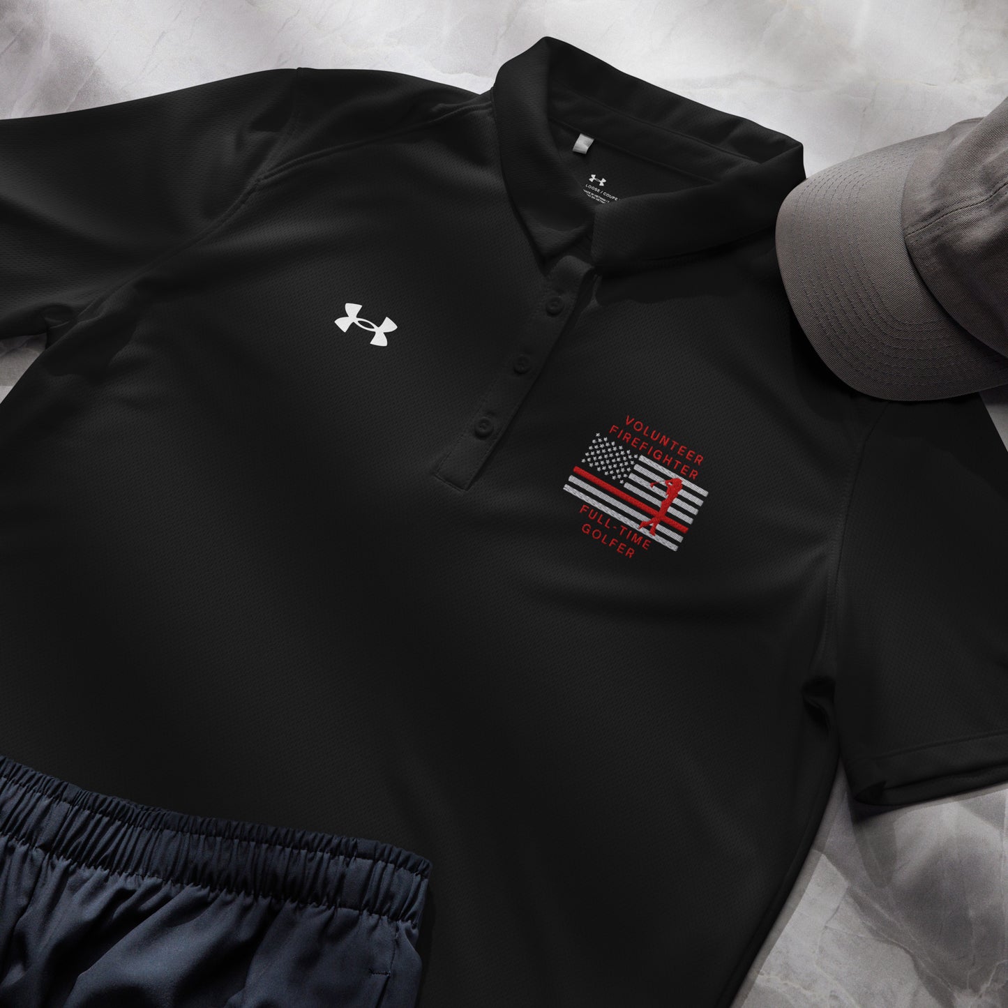 Women's black Under Armour polo volunteer firefighter full-time golfer design front view