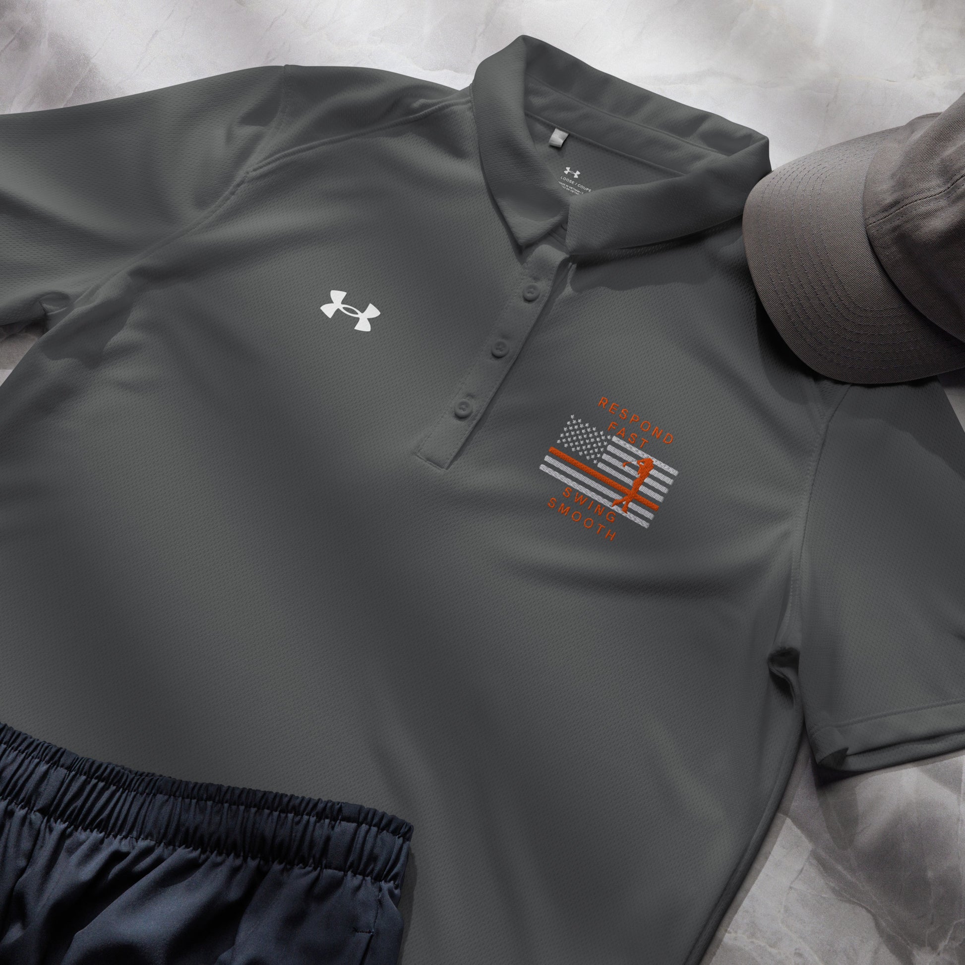 Grey women's Under Armour golf polo with Respond Fast Swing Smooth search rescue design