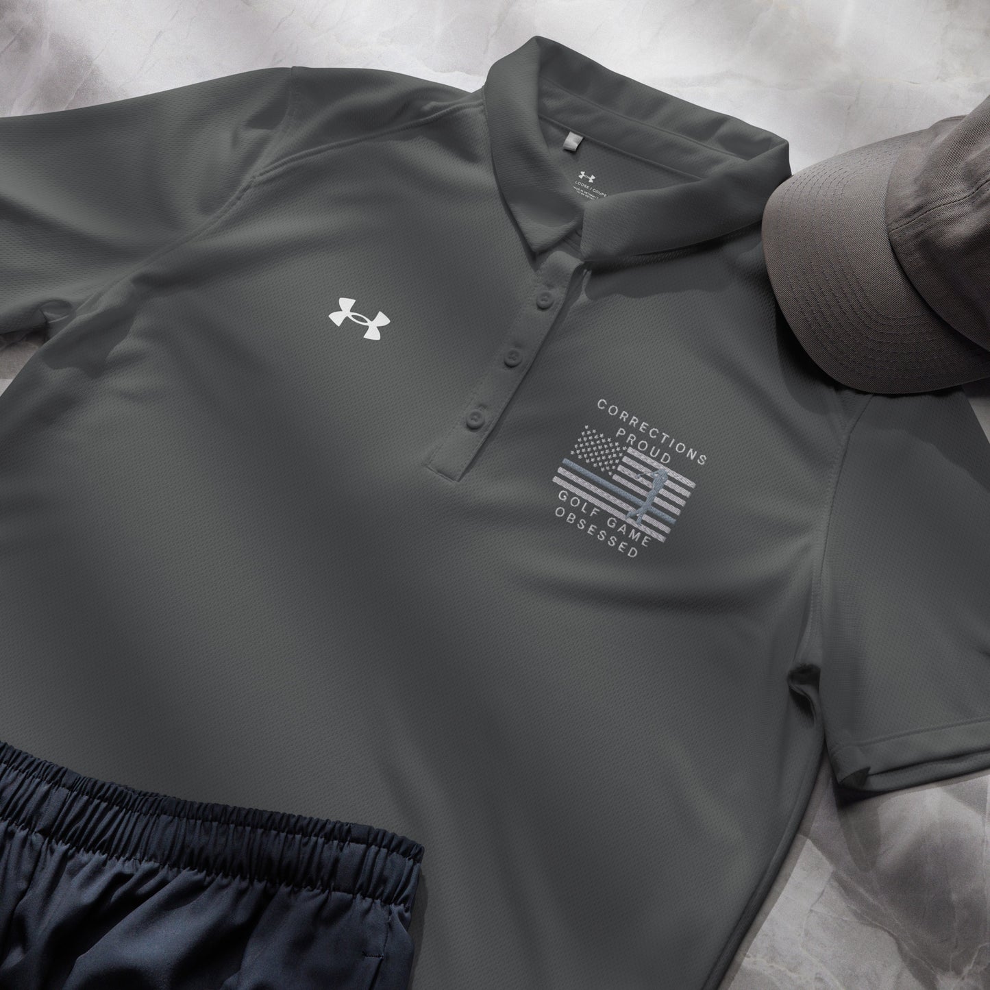 Grey women's Under Armour golf polo with Corrections Proud Golf Game Obsessed design