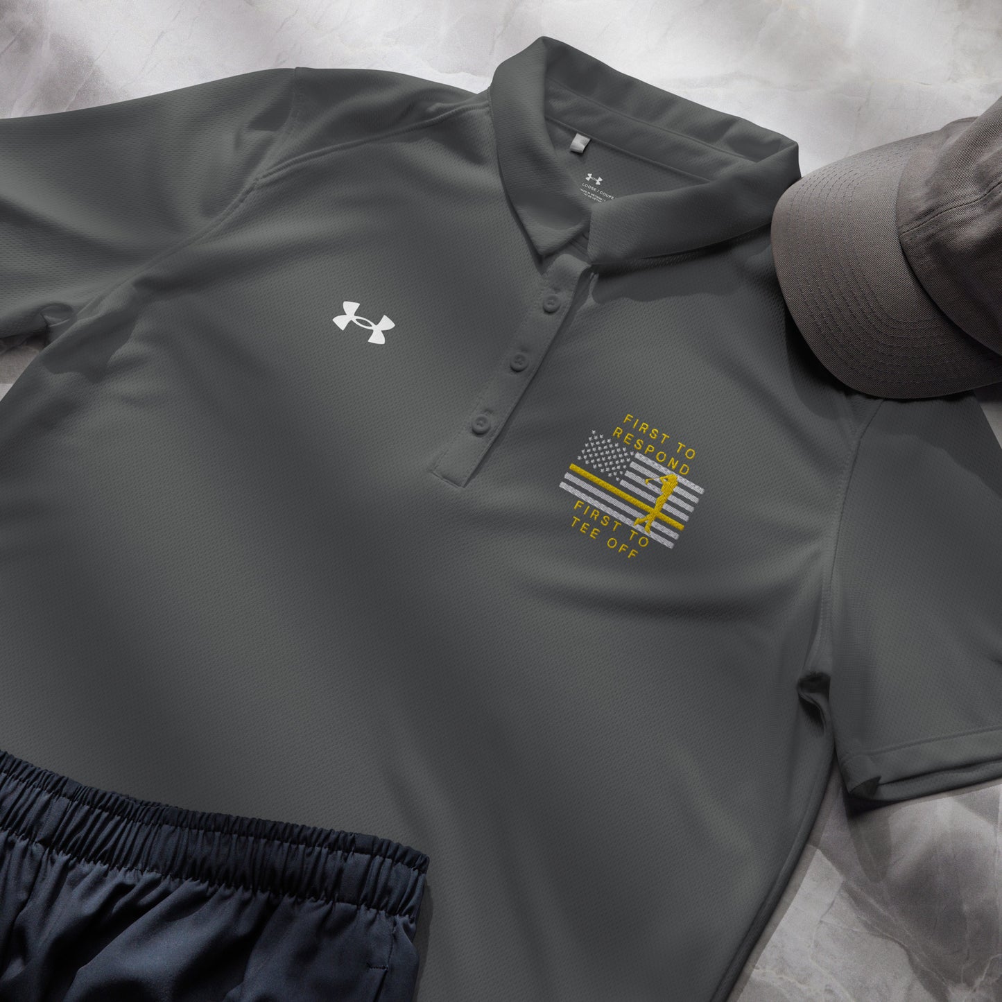 Grey first responder ladies golf shirt with gold line golfer flag artwork