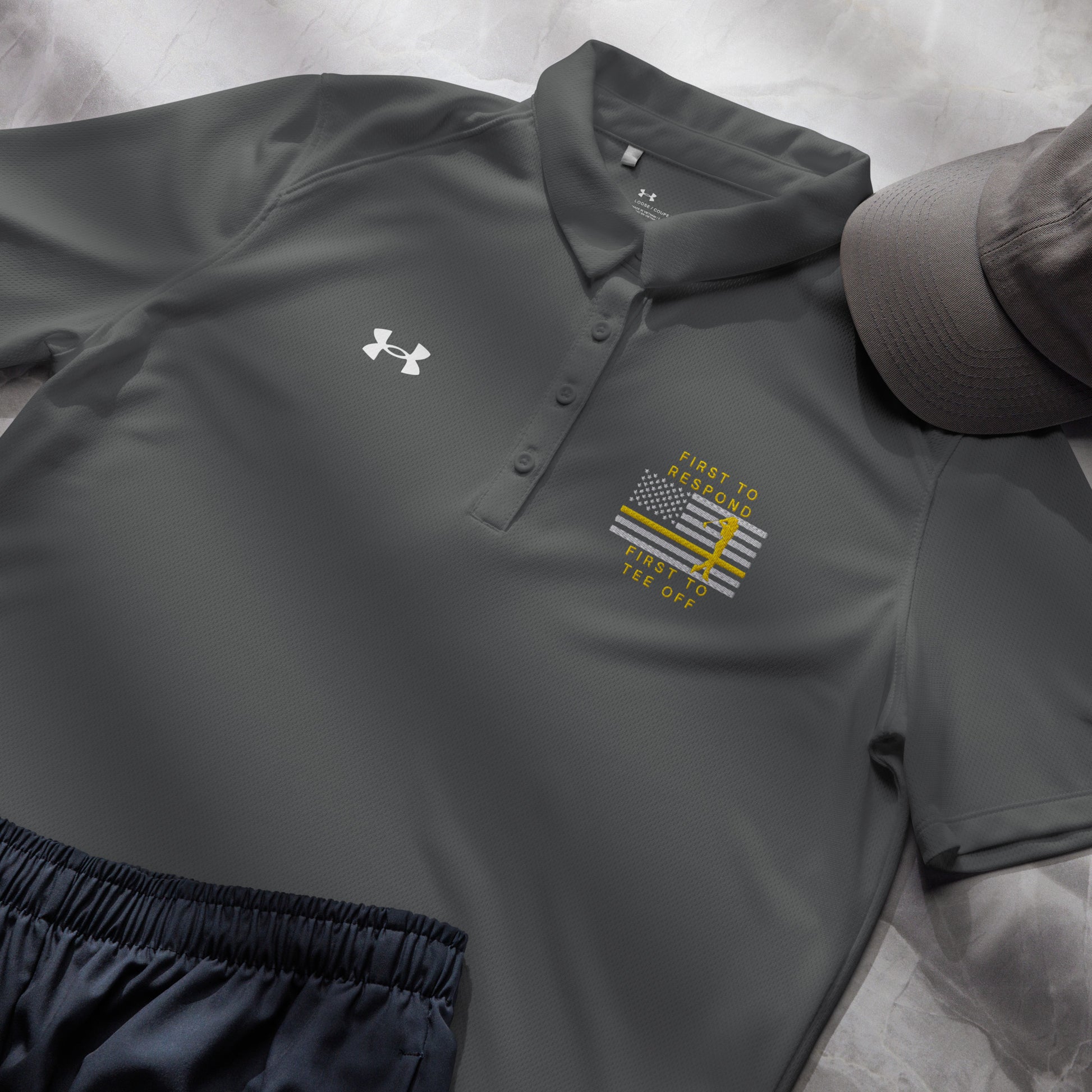 Grey first responder ladies golf shirt with gold line golfer flag artwork