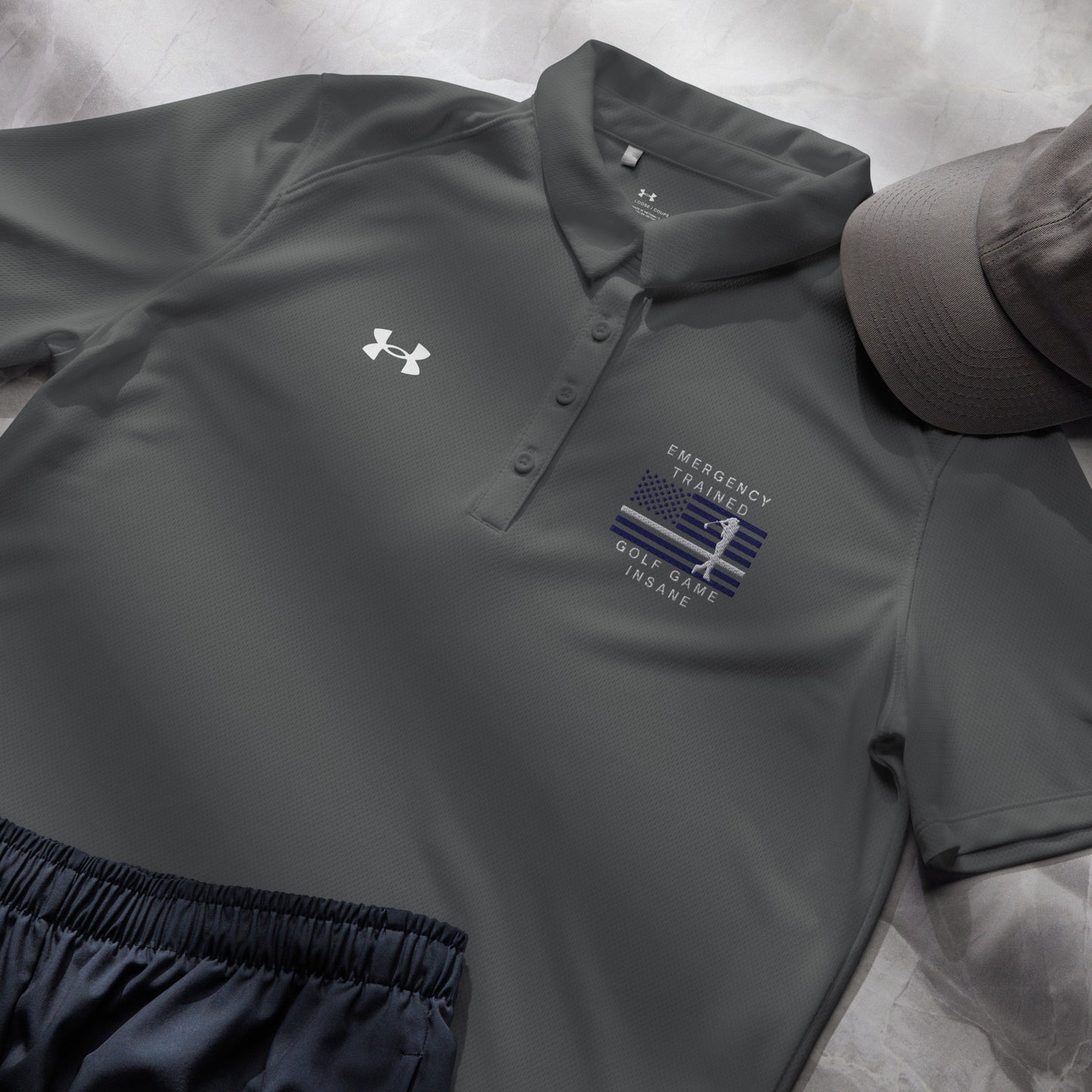 Grey ladies performance golf shirt with blue line golfer flag artwork